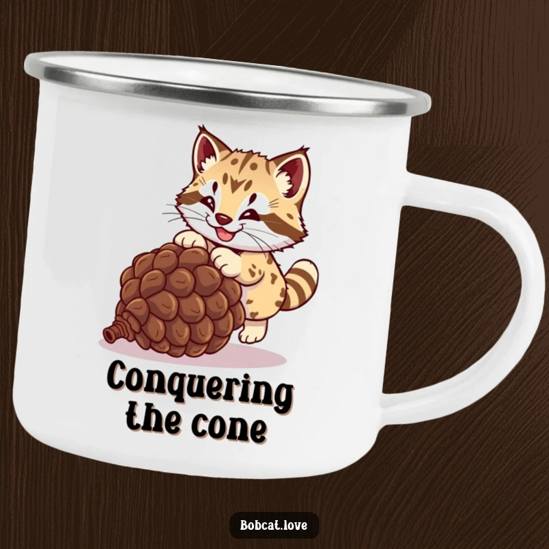 Funny bobcat camping mug, a wild cat joyfully chasing a rolling pinecone, perfect for outdoor enthusiasts and lovers of humor.
